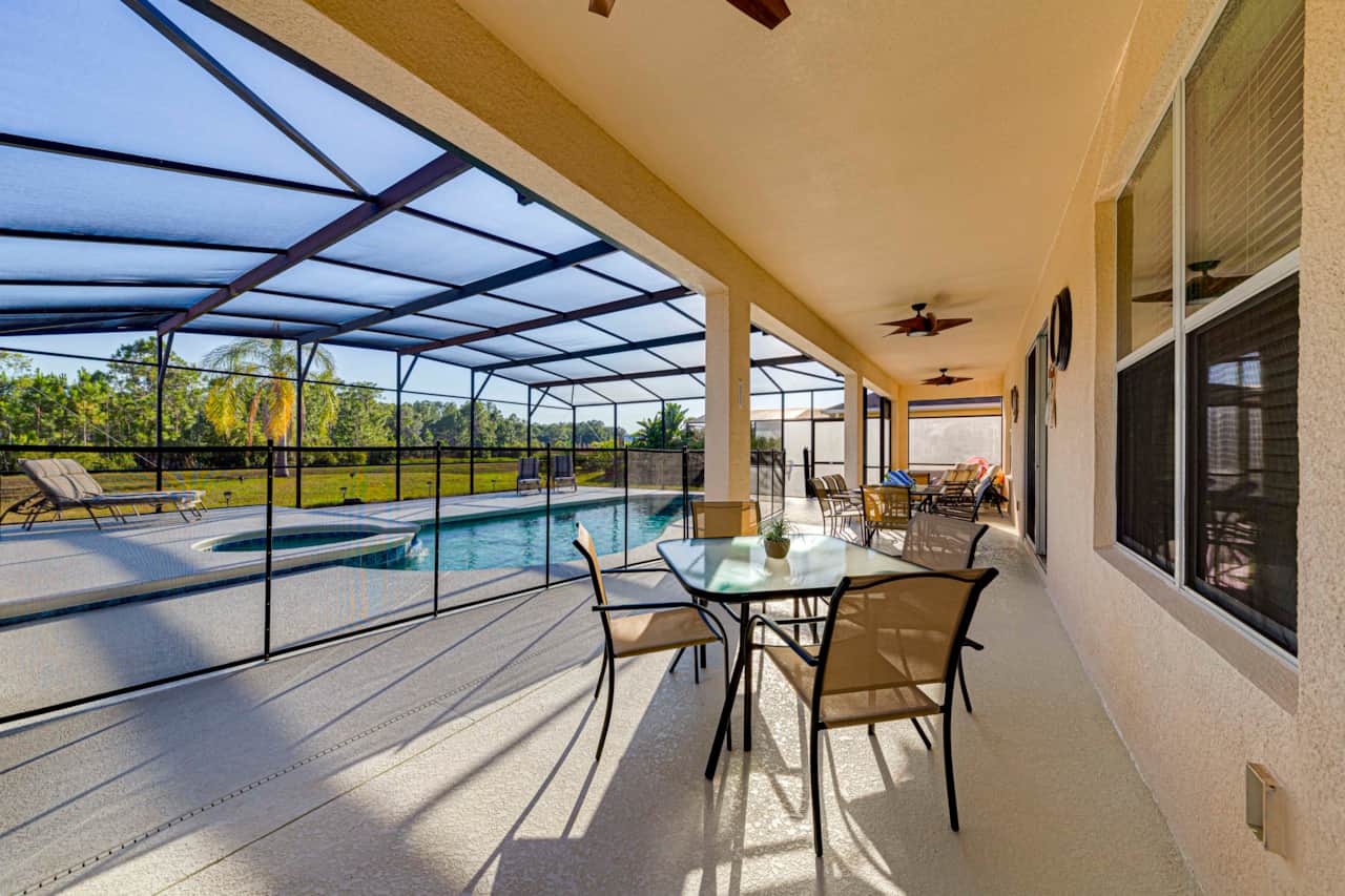 Large Full-Width Lanai Patio with Three Seating Formations and Outdoor Shower!