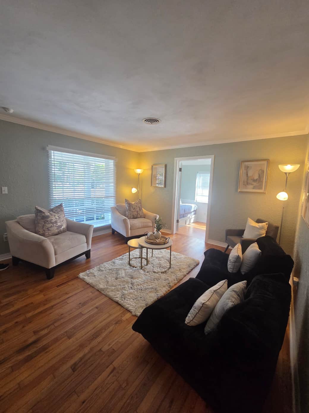 Cozy space with window blinds, center table, and decorative rug. Lakeland, FL Cozy space with window blinds, center table, and decorative rug. Lakeland, FL