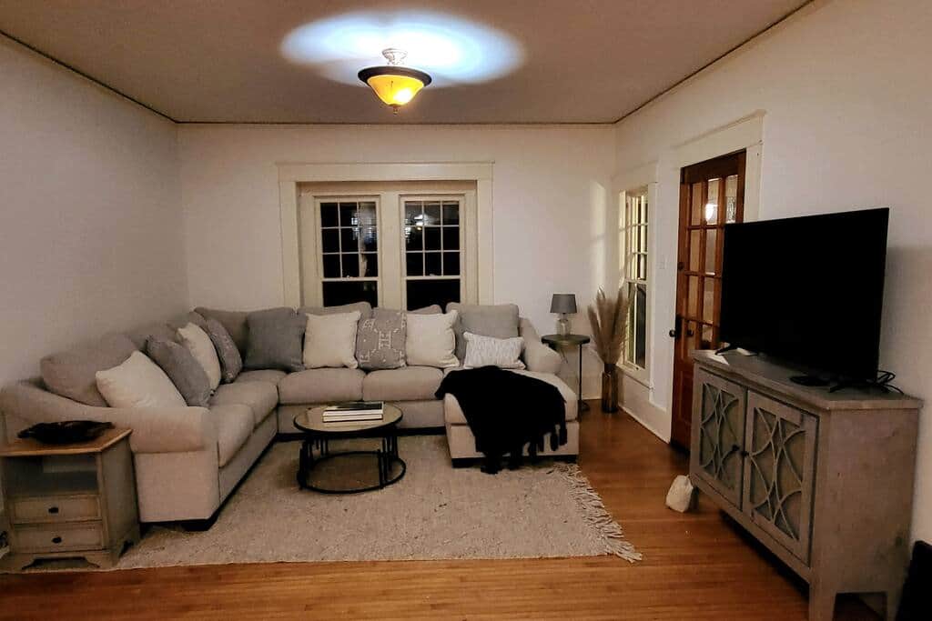 Main living area with a large sectional and a 42" TV.