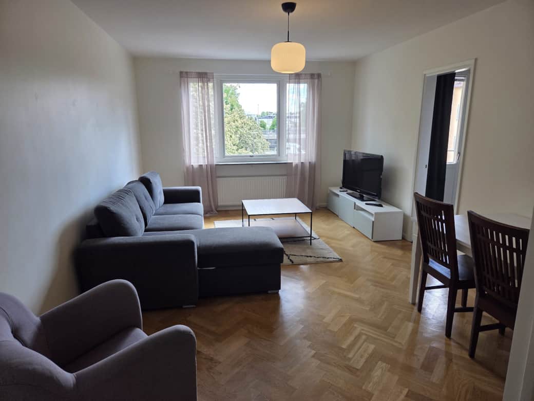 Living room with dining area and TV