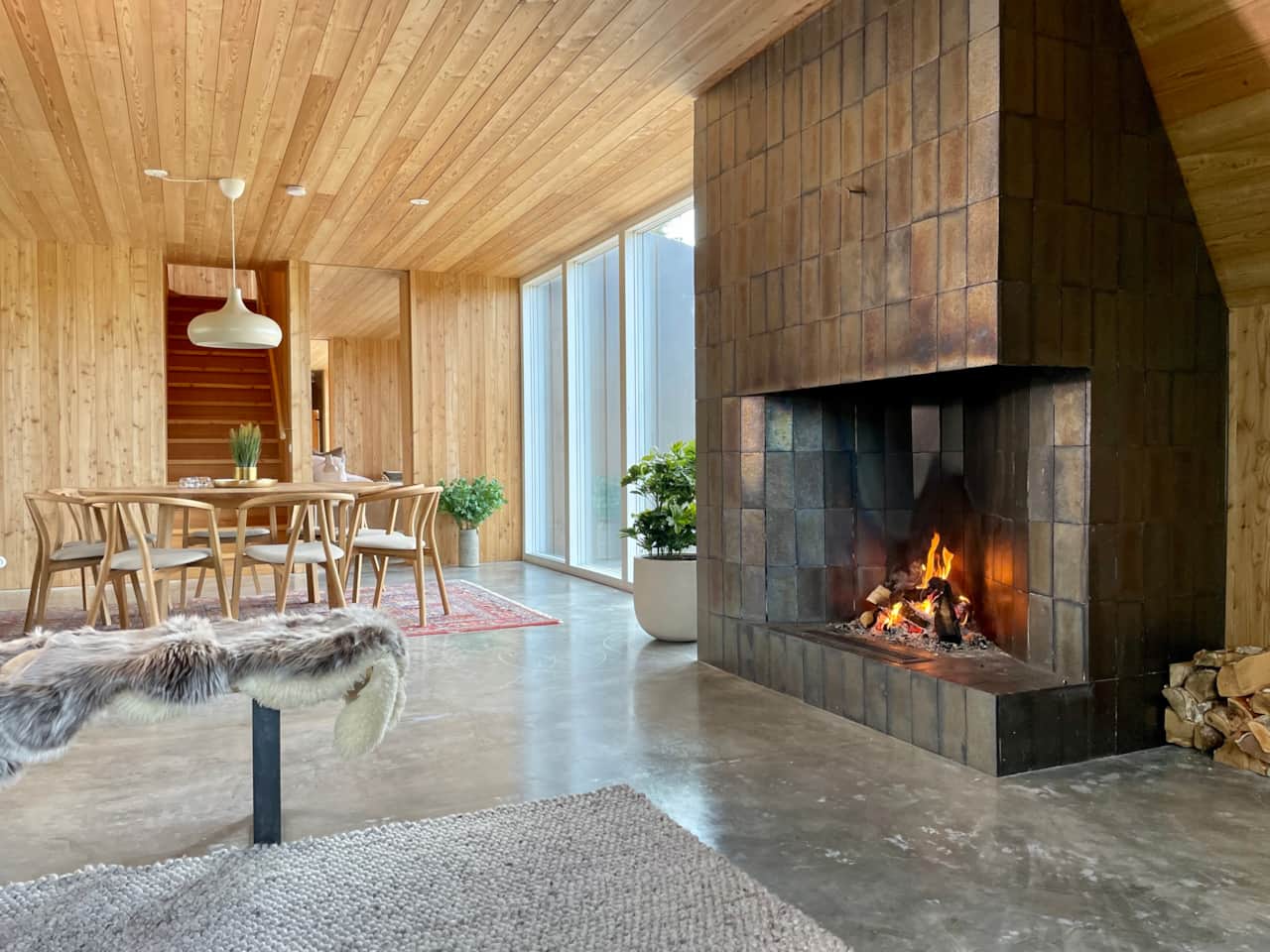 Amazing modern fireplace  next to the dining table 