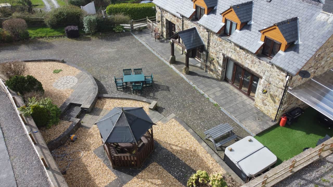 Overhead view of parking and cottage courtyard