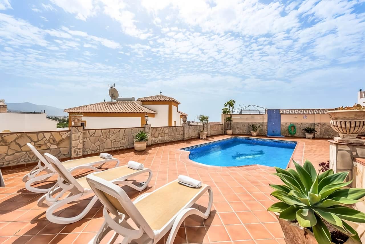 Private pool with sun loungers at Villa Lorena, Nerja
