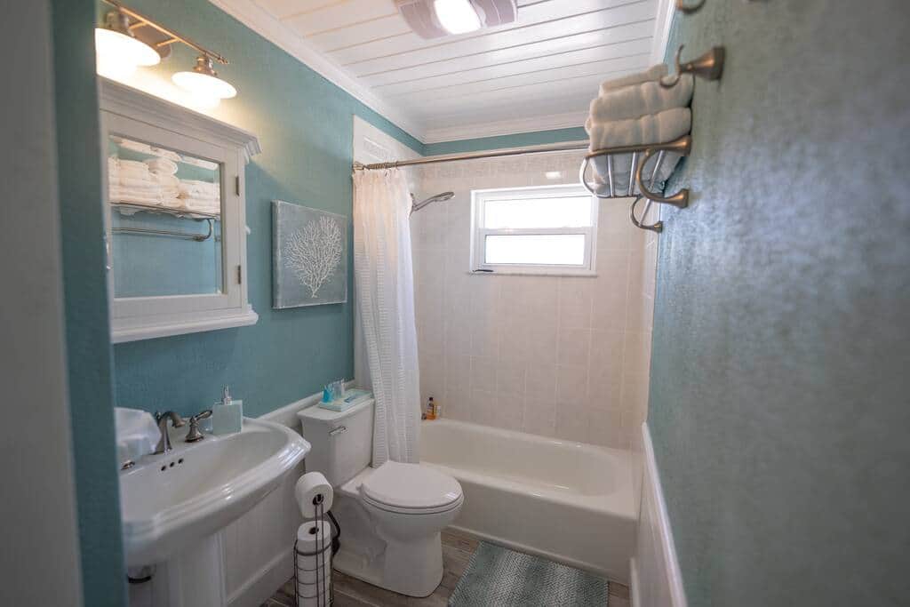 Full guest bathroom in main hallway with tropical soaps and plush towels located in hallway Full guest bathroom in main hallway with tropical soaps and plush towels located in hallway