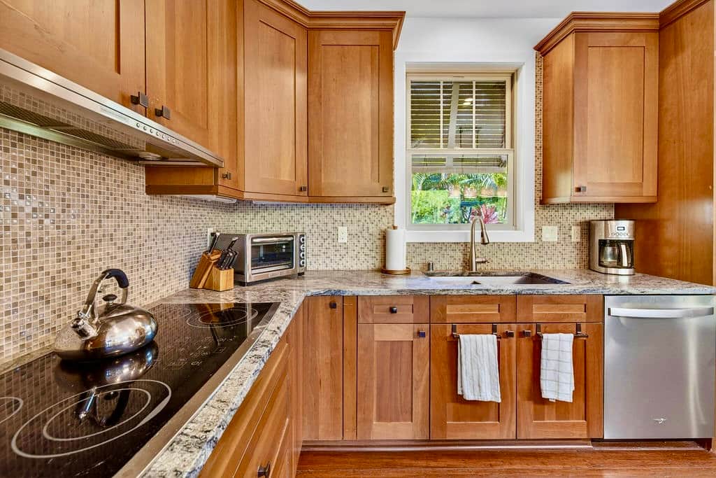 Warm kitchen with mosaic tile. Vacation cooking never looked so good.