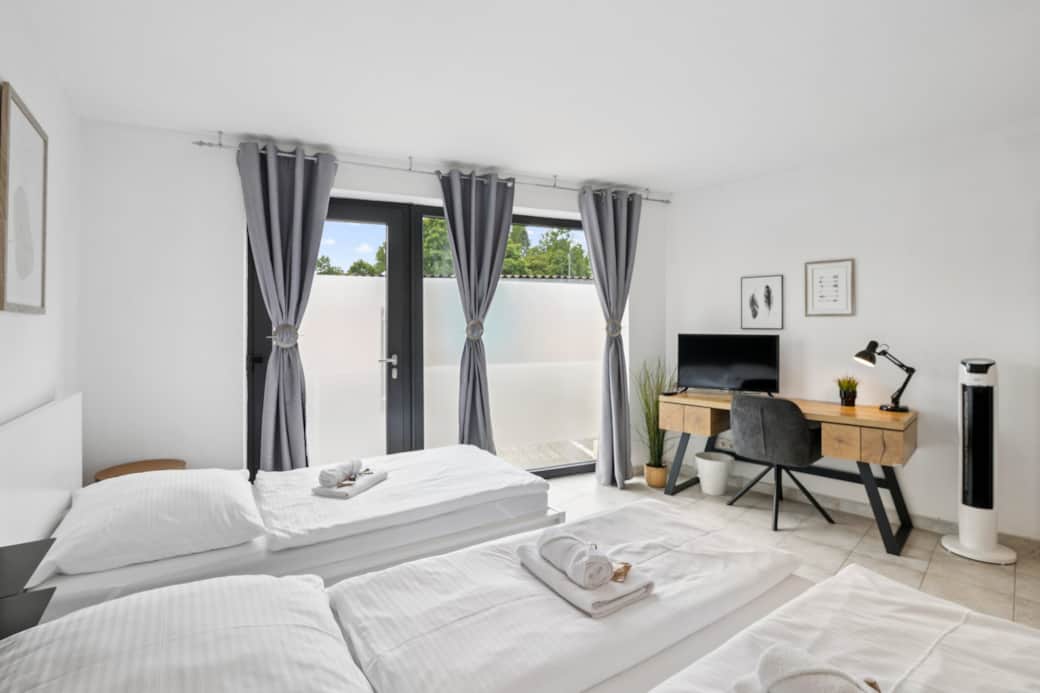 Bedroom 5 with double bed and single bed and workstation Bedroom 5 with double bed and single bed and workstation