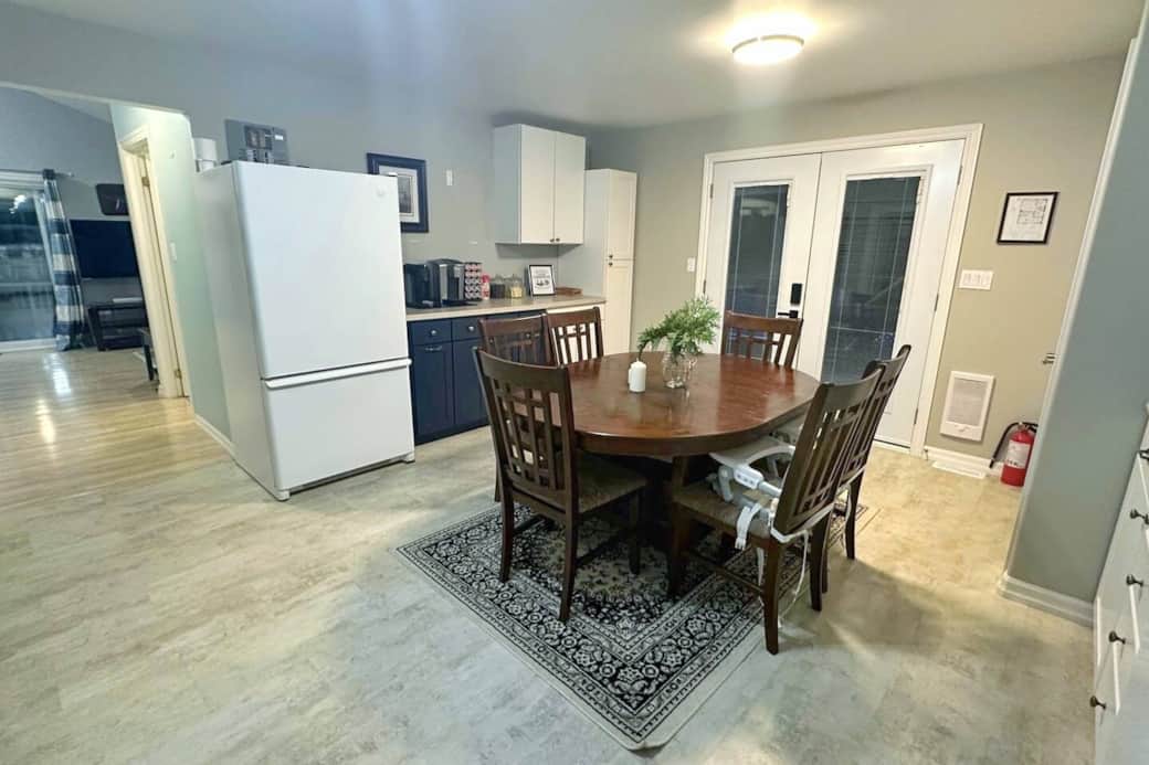 Cozy dining area with seating for six and easy access to the back deck through the patio doors.