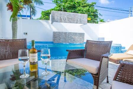 Day or night, it's always a good time for a glass of wine by the pool. Day or night, it's always a good time for a glass of wine by the pool.