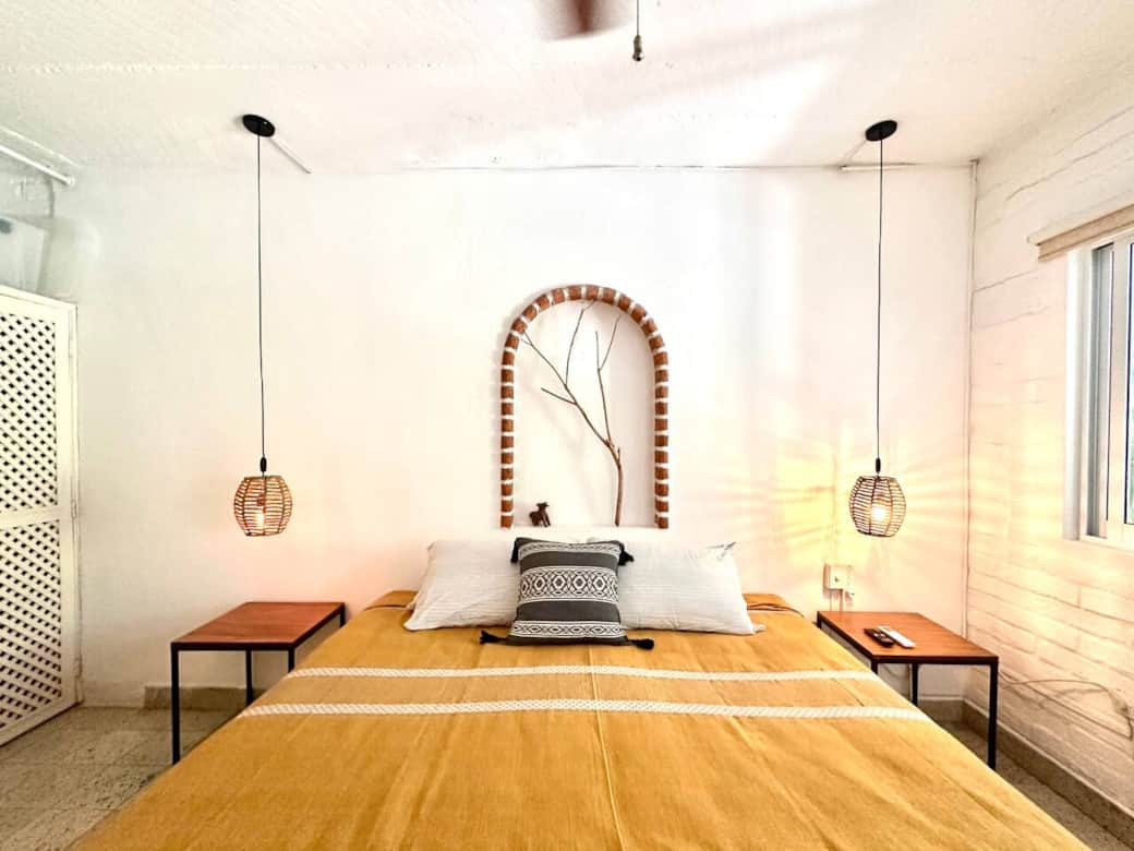 Serene bedroom with warm tones and soft lighting — a peaceful retreat designed for rest, comfort, and slow mornings.