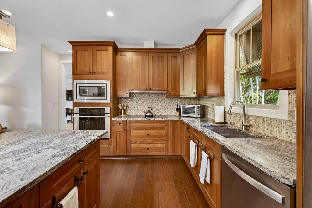 Custom mosaic backsplash. This kitchen is as gorgeous as it is useful.