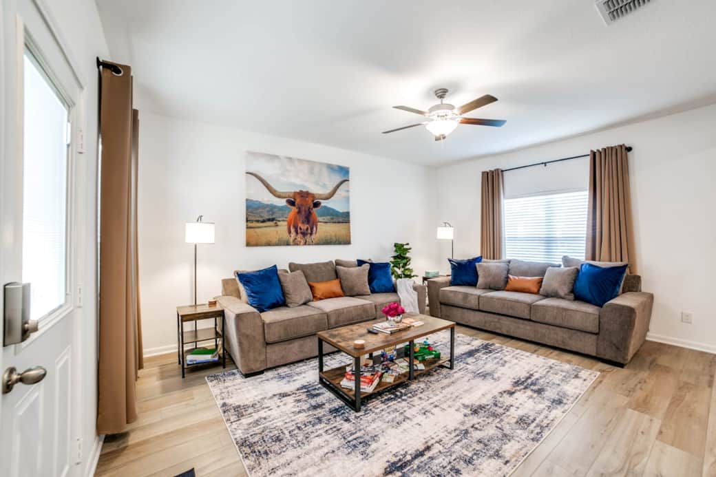 Living Room with 65" TV with FREE Hulu, Disney + and ESPN and two LARGE sofas