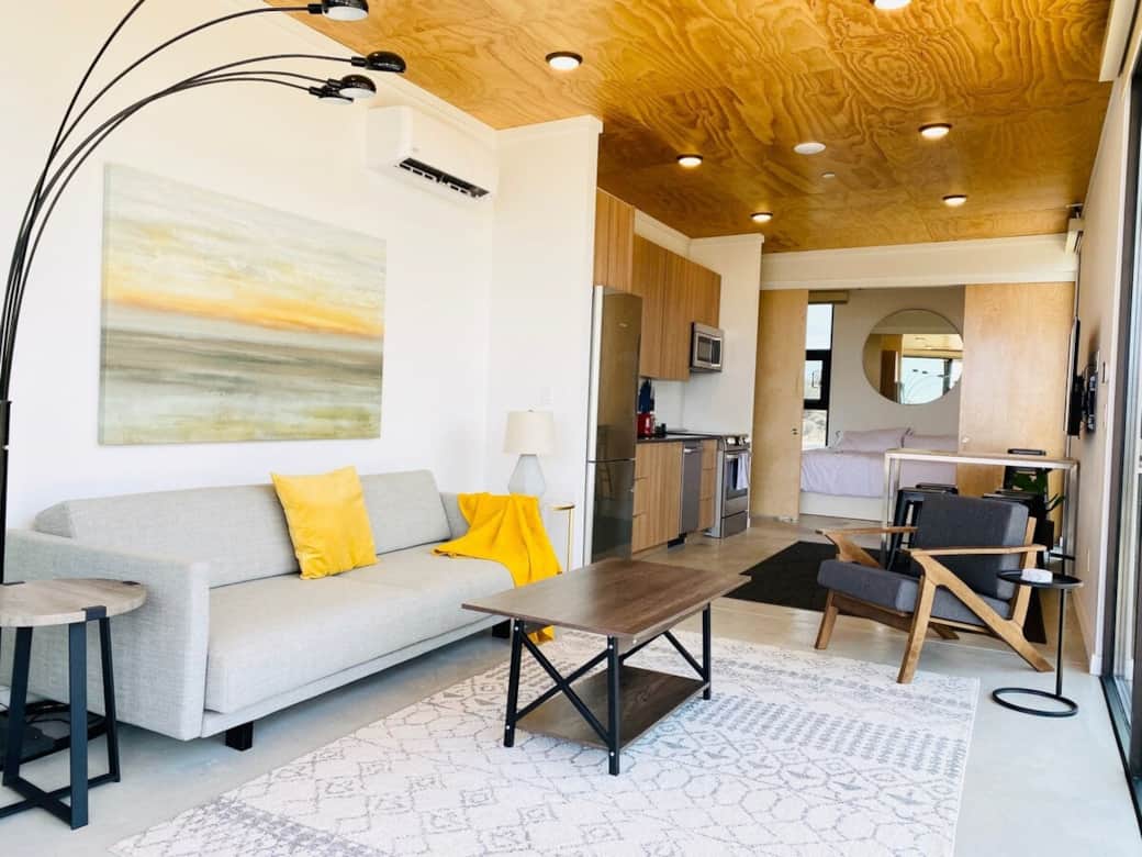 Living room, kitchen & dining area, tv, and bedroom is behind the sliding doors. The unit on the wall is the Heat & AC unit.