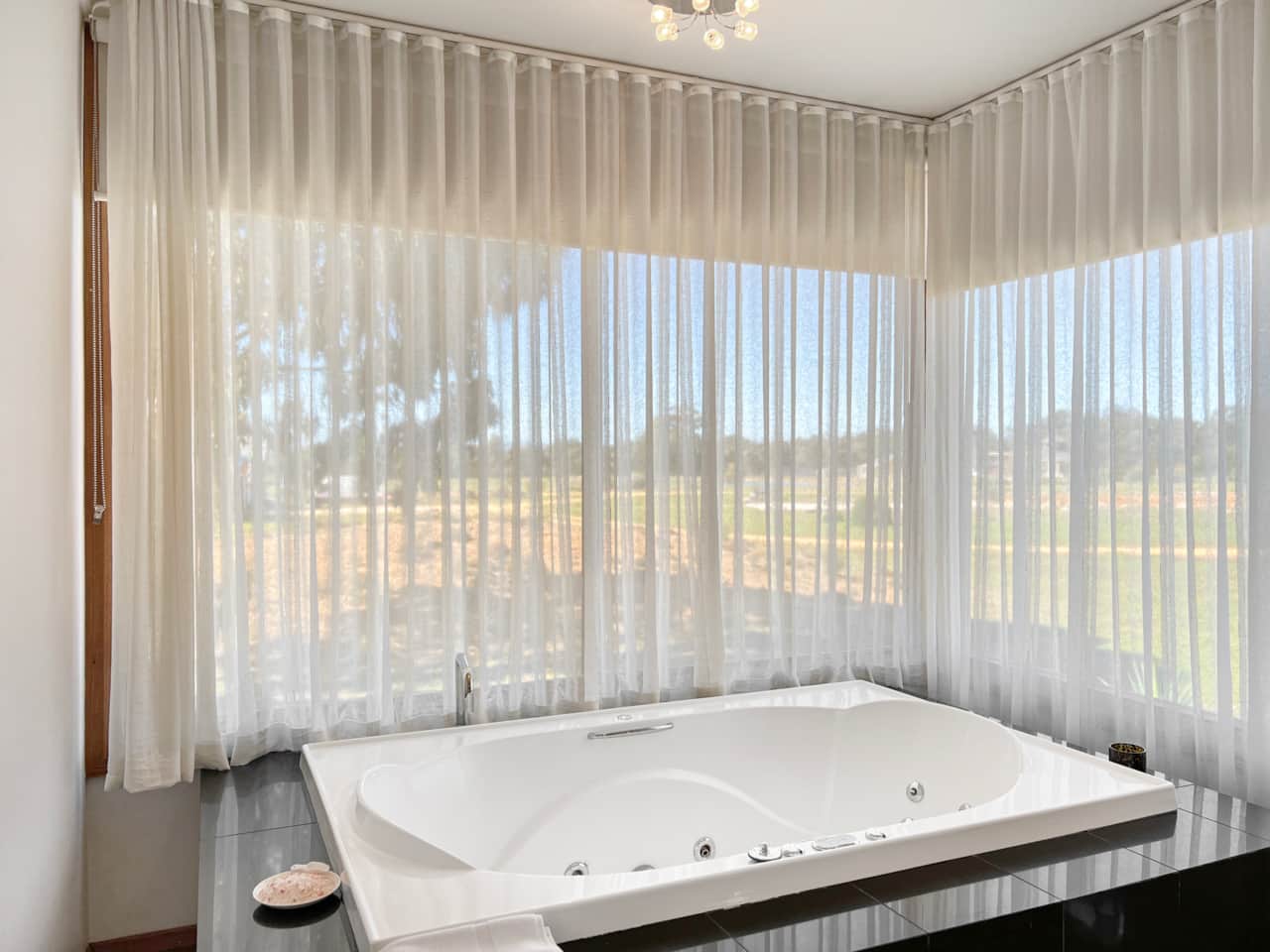 Enjoy relaxation in our bathroom with a soothing bathtub. Unwind for a refreshing stay.