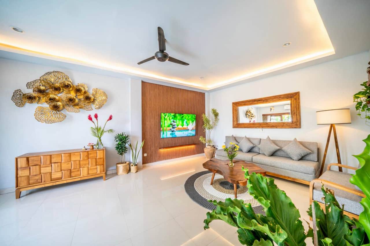 Spacious living area with pool view and modern décor