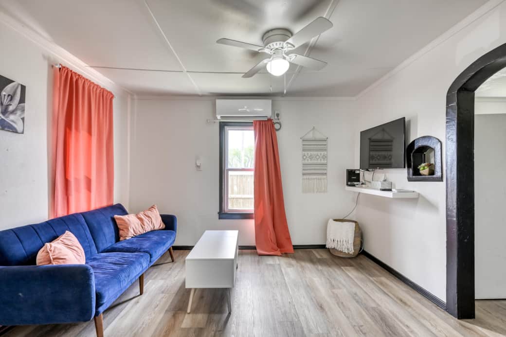 Living Room with futon couch. The coffee table converts for work or eating space. Living Room with futon couch. The coffee table converts for work or eating space.