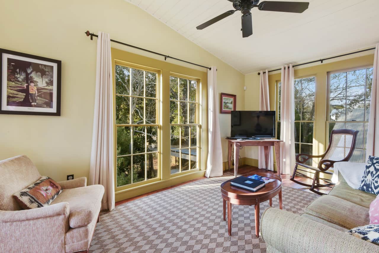 View of the living room with large custom windows. 