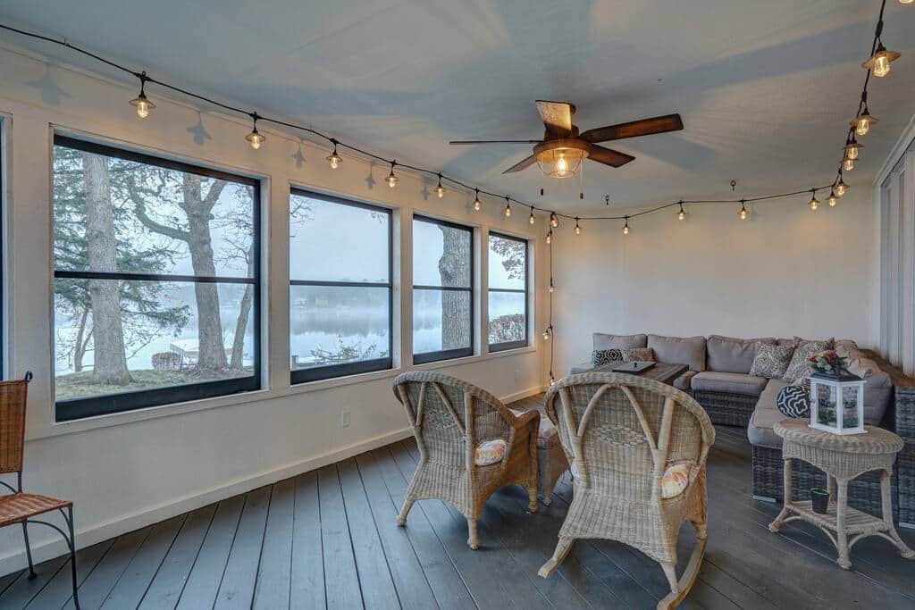 Screened porch with fire table