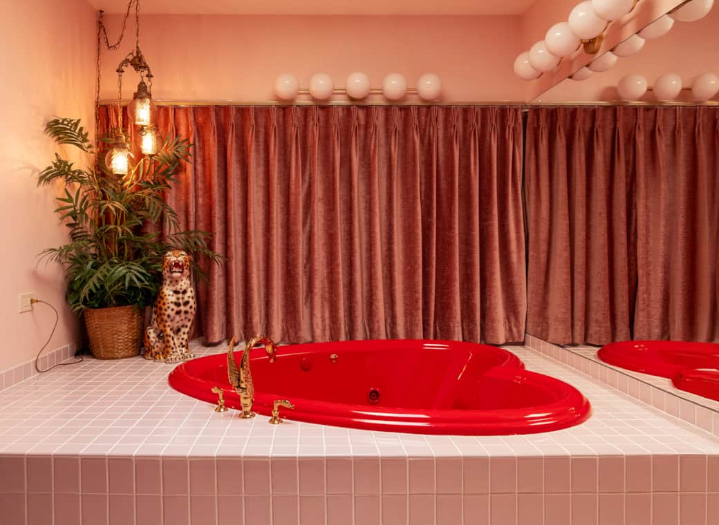 Heart-shaped jacuzzi tub in a vintage-inspired bathroom Heart-shaped jacuzzi tub in a vintage-inspired bathroom