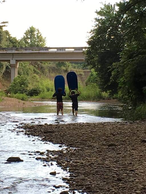 Kids enjoying the creek - walk up then float down.. pretty good exercise!