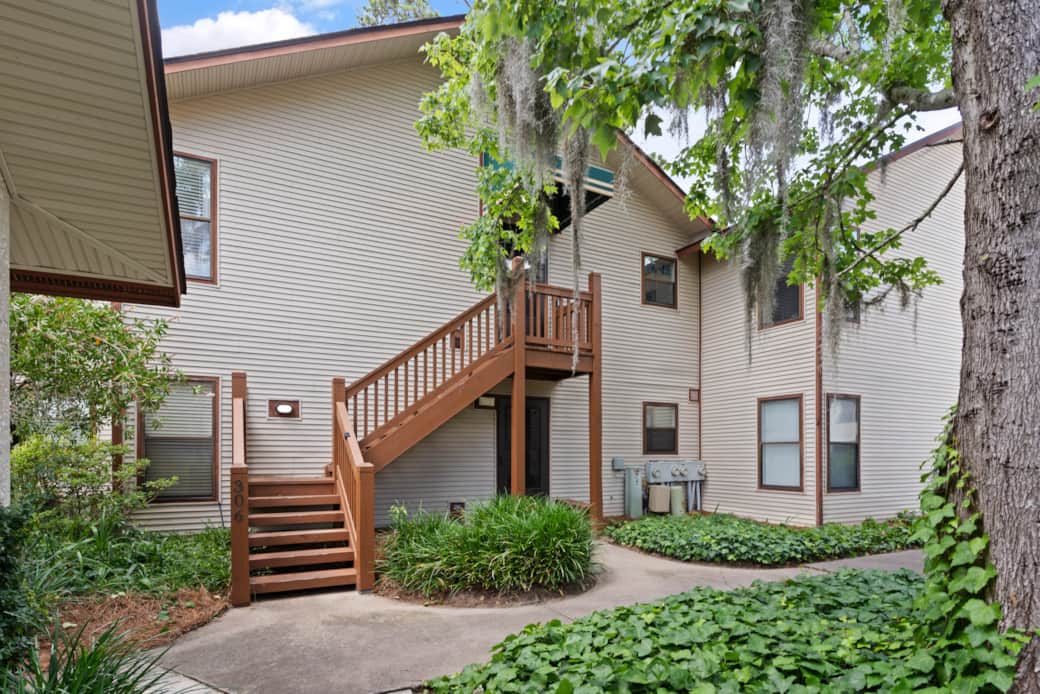 The exterior of the building shows the condo's own staircase leading to the 2nd floor condo. 