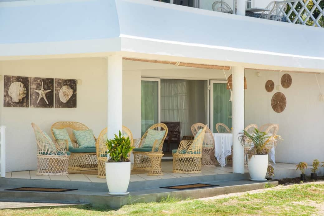View of the ground floor apartment from the garden and parking area