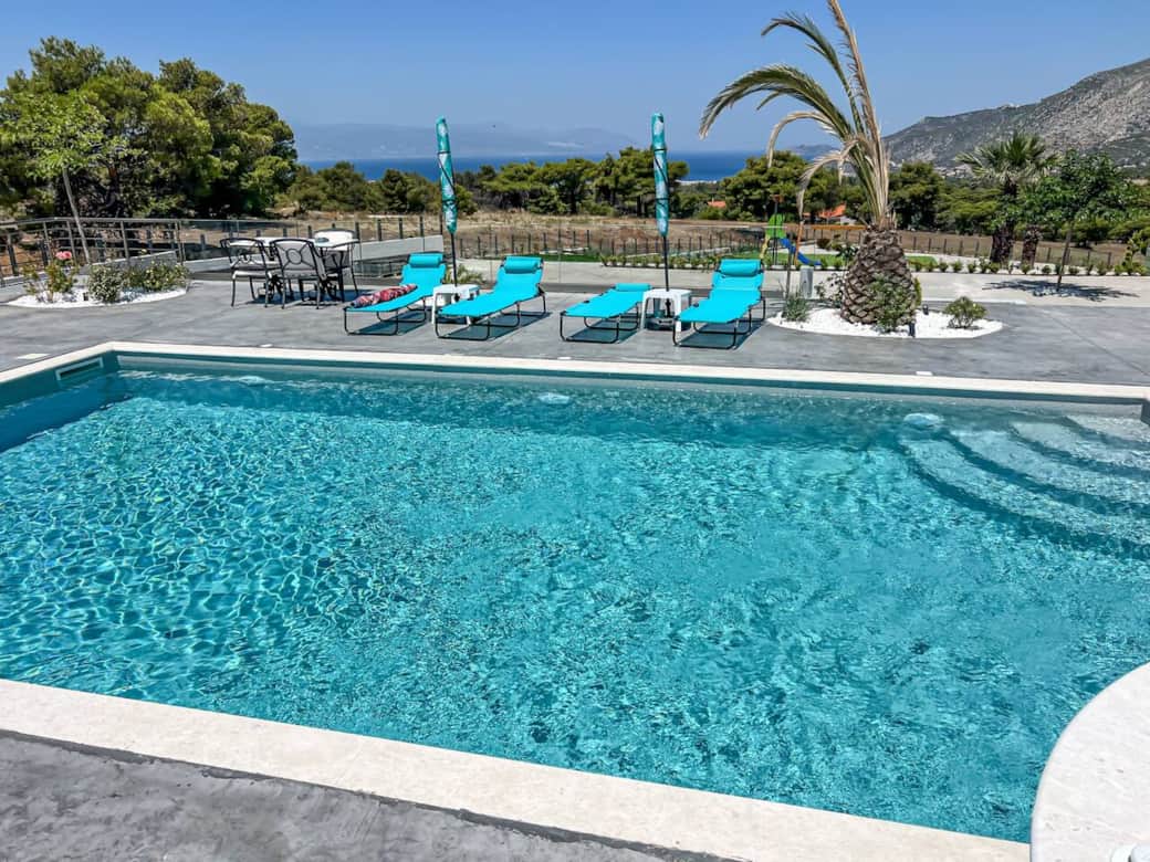 Large pool area with sea views