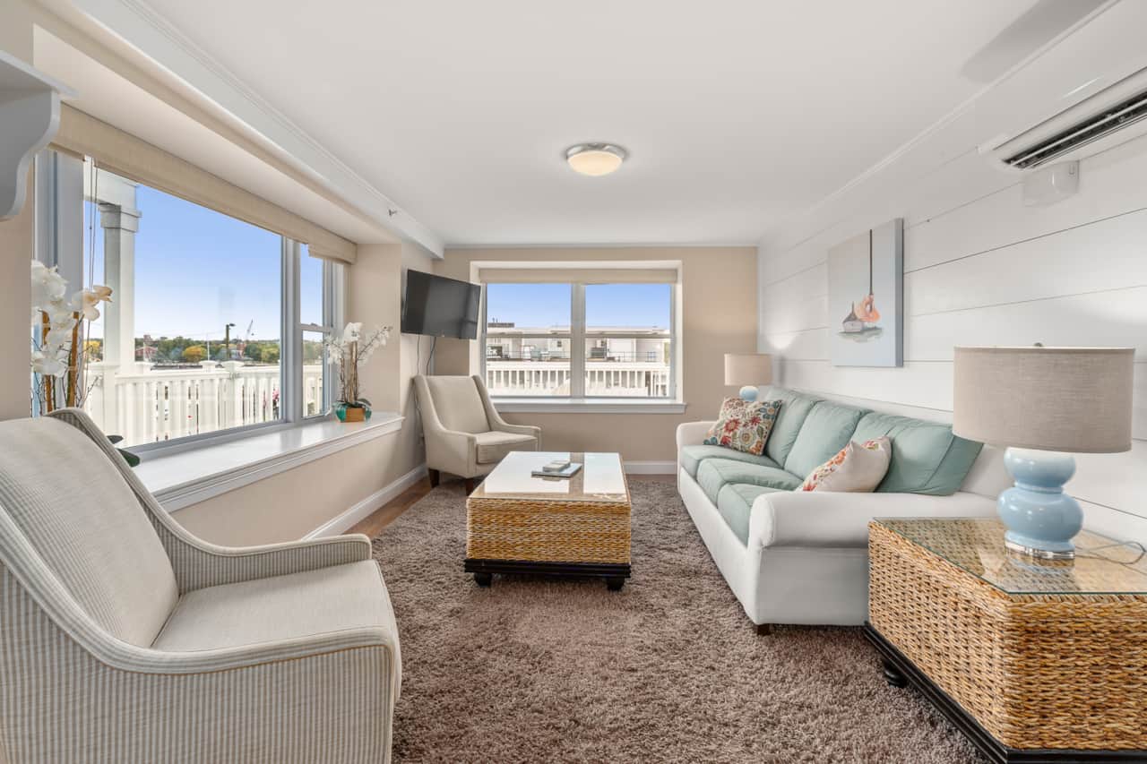 Living Room With All The Views. Watch boats come and go from your couch!