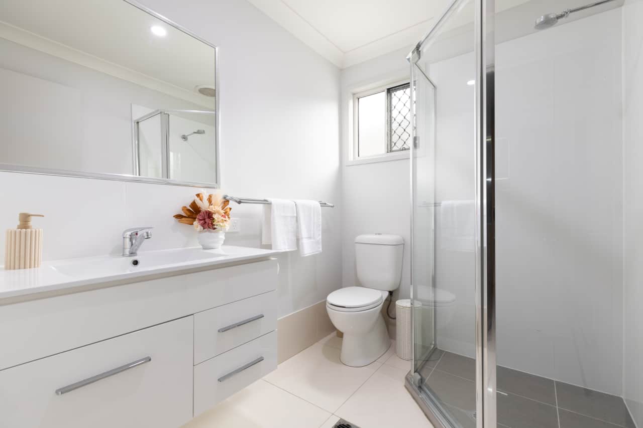 Bathroom: Stylish bathroom with walk-in shower, vanity, and clean finishes 