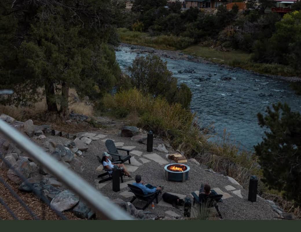 Enjoying the sounds of the river and a camp fire
