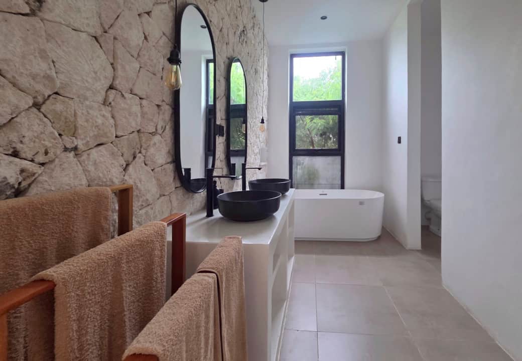 Master bedroom with natural stone ensuite bathroom