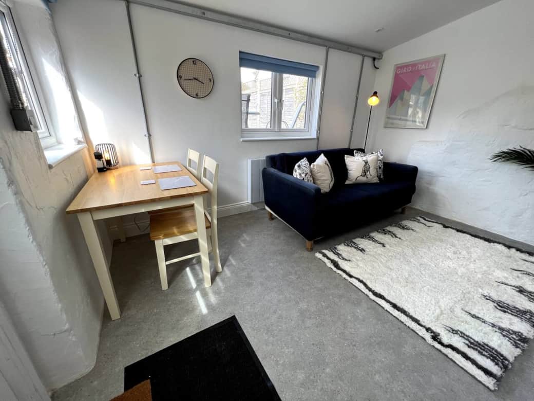Living area with dining table and sofa