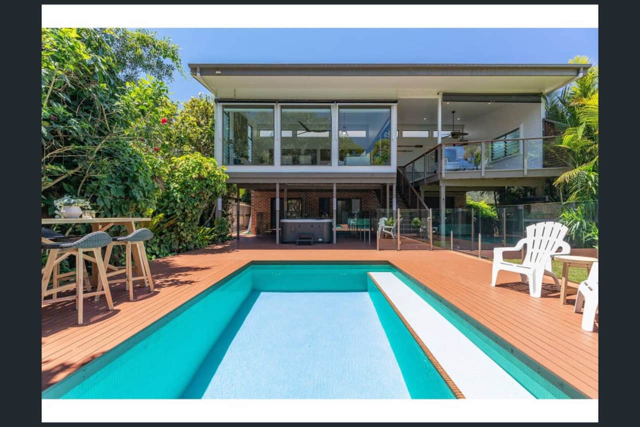 Backyard pool and spa with balcony outdoor seating