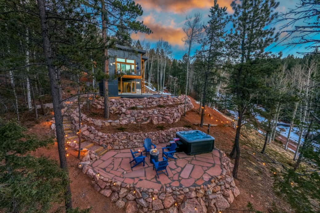 Surrounded by pine trees, the flagstone patio offers a secluded setting for hot tub soaks. Surrounded by pine trees, the flagstone patio offers a secluded setting for hot tub soaks.