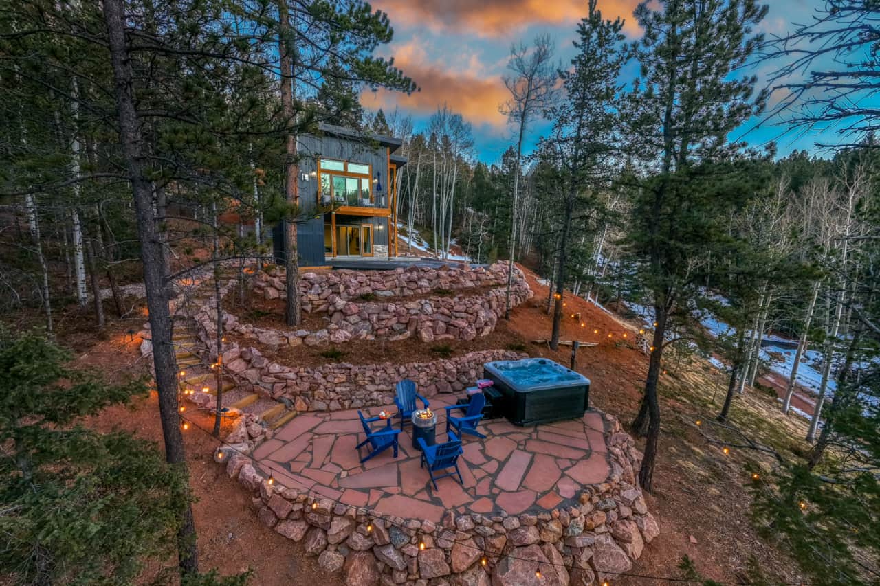 Surrounded by pine trees, the flagstone patio offers a secluded setting for hot tub soaks.