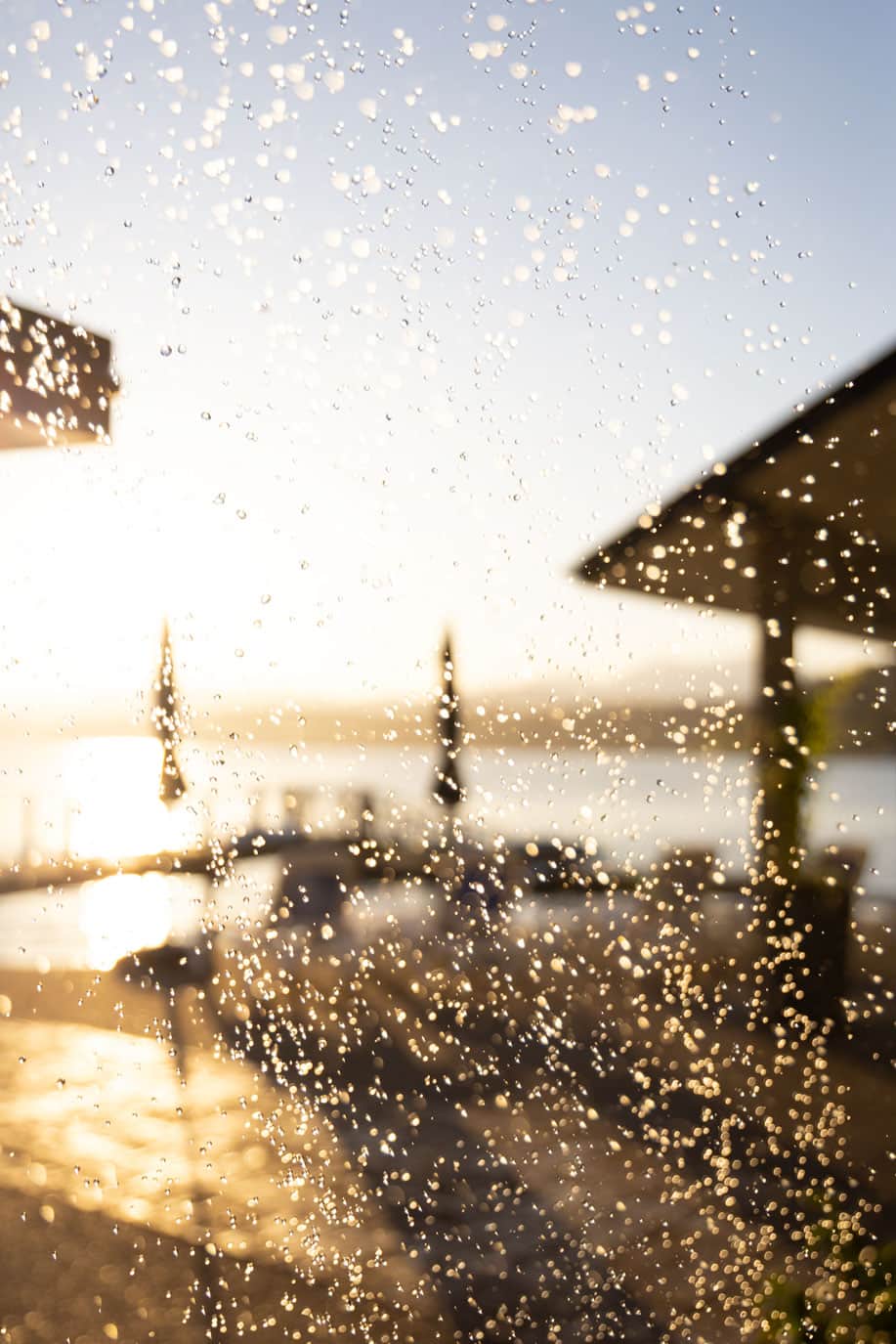 Outdoor shower overlooking the fjord and mountains, right by sauna and sun chairs