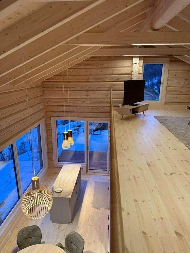 Gallery with views of living space and fjord – Scandinavian-style living