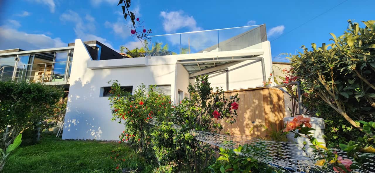 Floeca modern villa with lush garden and rooftop pool — bright, peaceful Madeira escape