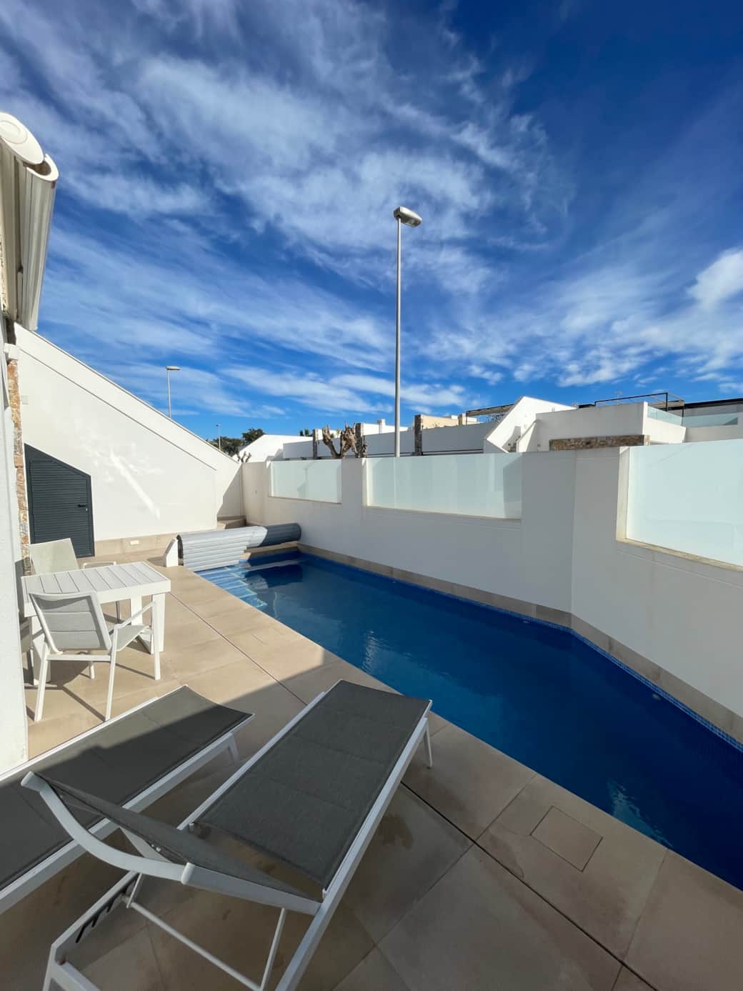 Refreshing private pool with lounging area to relax
