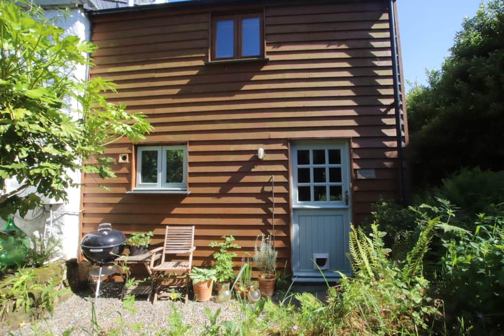 Steps down from driveway to front courtyard with side access to rear garden. Steps down from driveway to front courtyard with side access to rear garden.