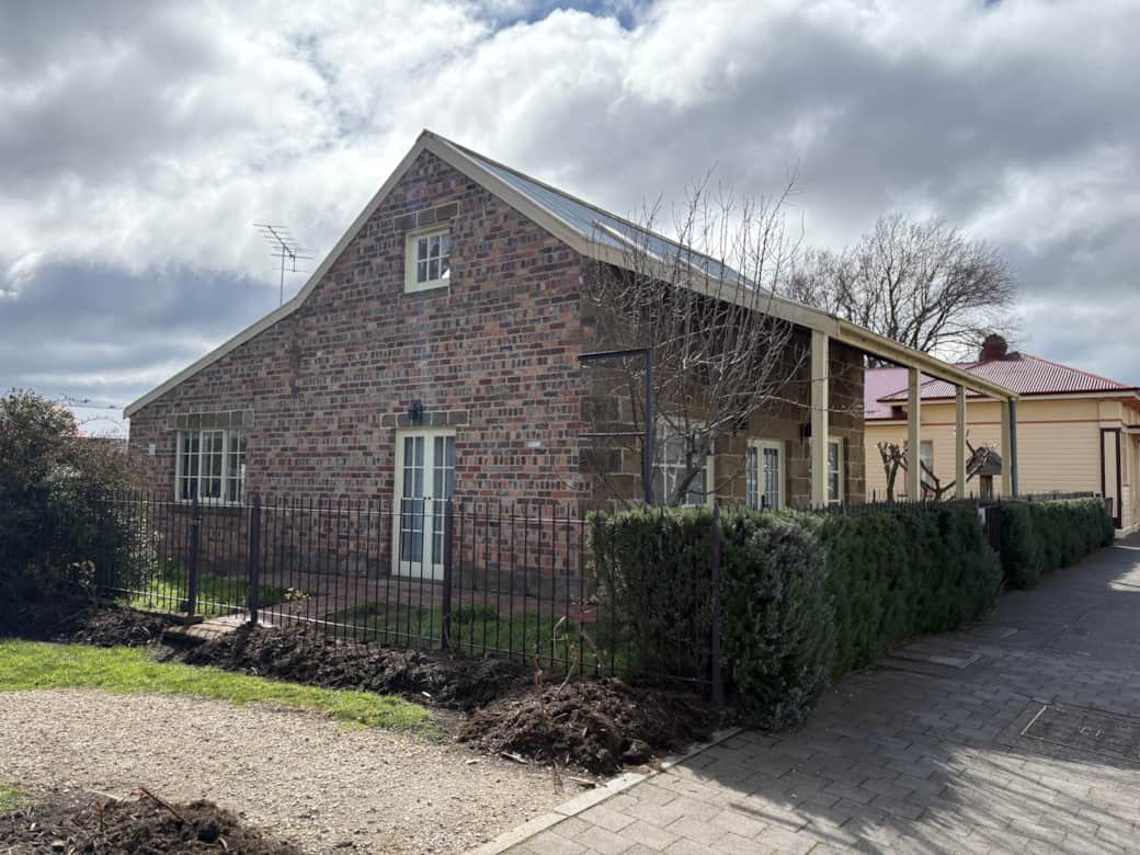Discover a brick & sandstone cottage where historic charm meets light-filled modern interiors.