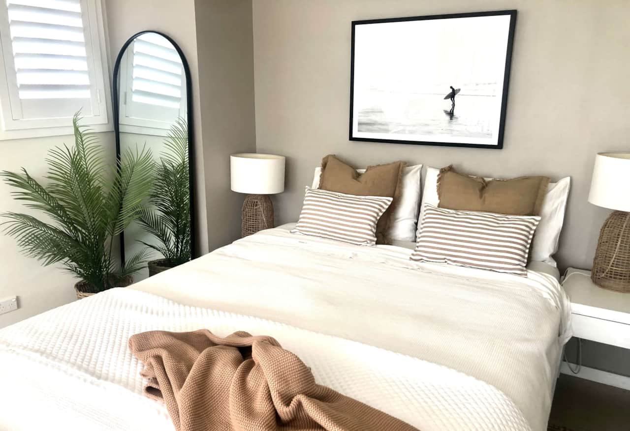 Experience ultimate relaxation in our luxury queen bed at Shutters by the Sea Kiama. 
