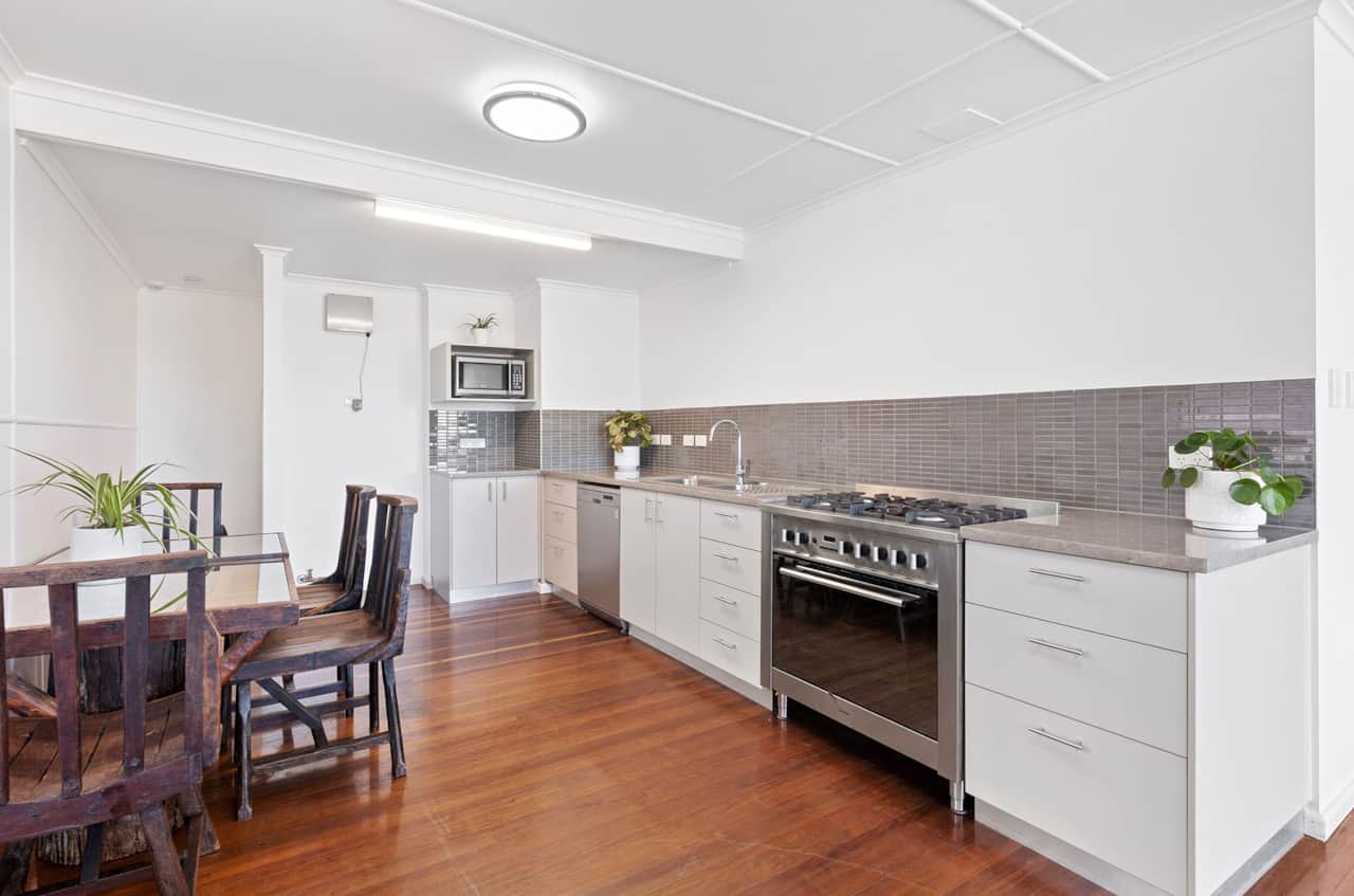 Modern, well appointed kitchen. Large stainless electric oven with gas 6 burner cooktop
