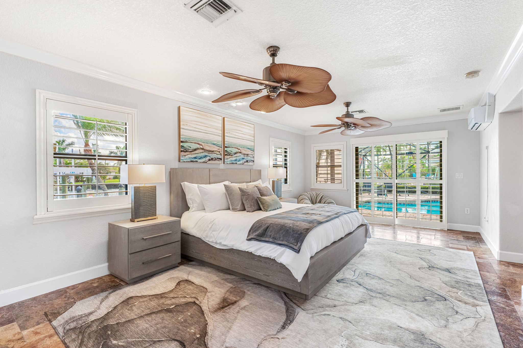 Wake up to serene poolside views in this spacious master suite, your private space for relaxation.
