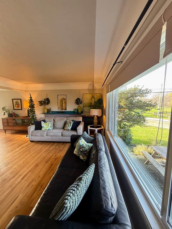 Step into a spacious, sun-drenched living room offering sweeping views of Horner Park. 