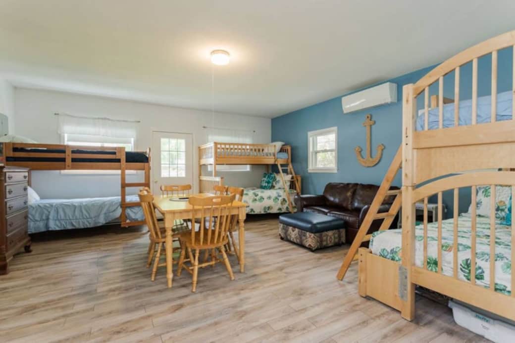 Bedroom#4 is referred to as the Bunk House.  It has sleeping for 8.  Barn door seperates main house