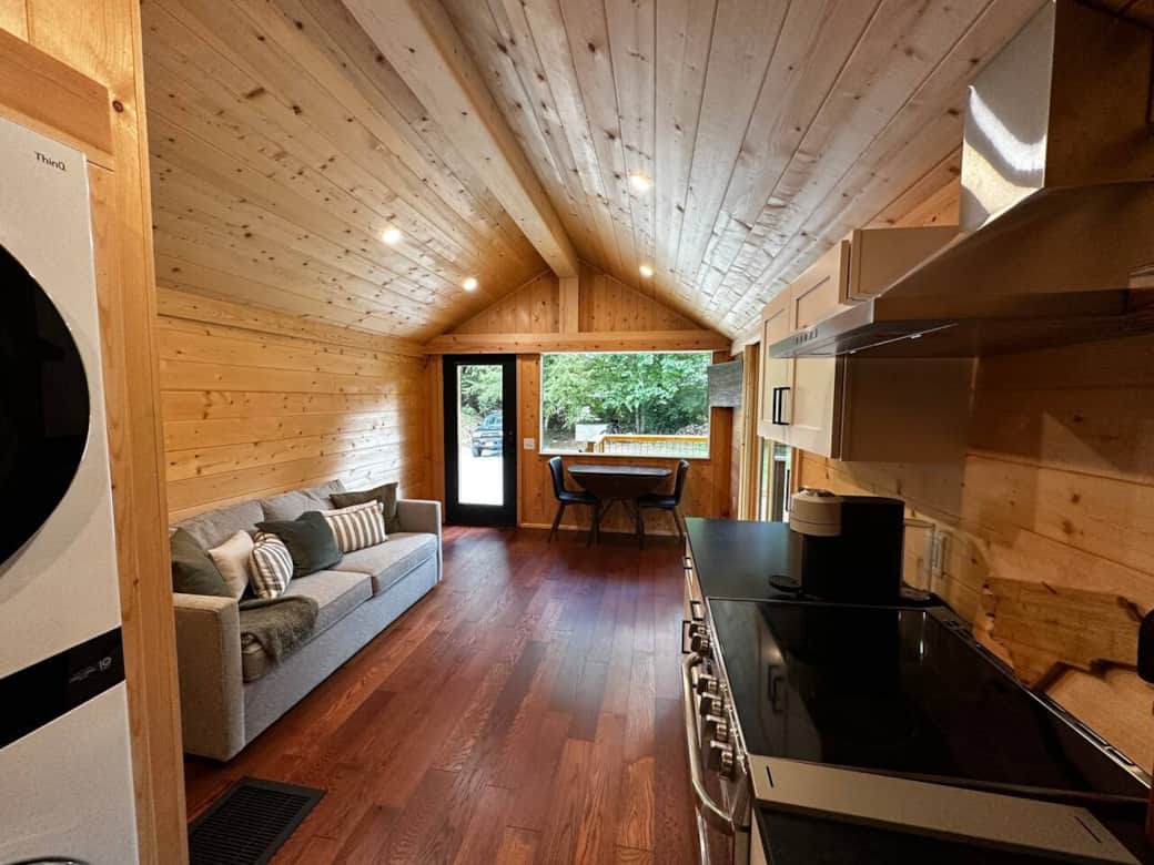 Light-filled gathering space that opens directly to the large deck and outdoor seating.