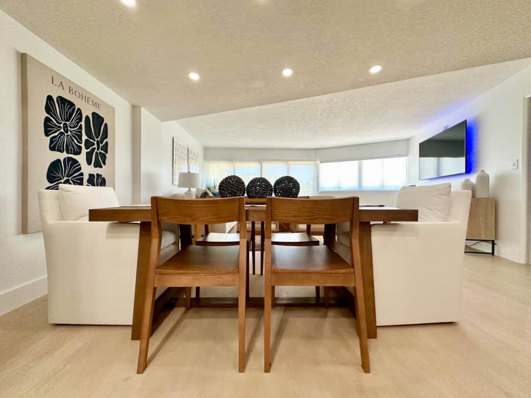 Gather around the beautifully designed dining table with seating for six and coastal charm