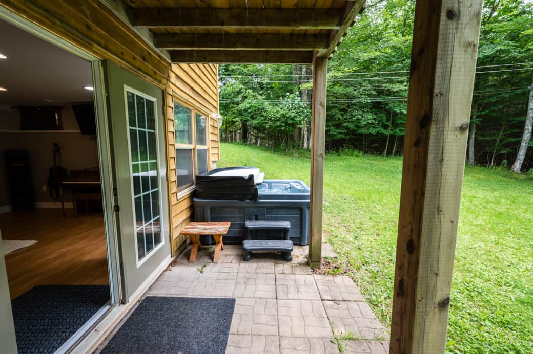 Lower level with  uncovered hot tub