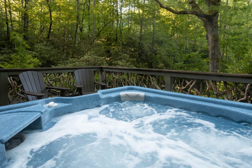 Private hot tub with forest views, creek sounds, and stargazing over 2 acres of rhododendrons.