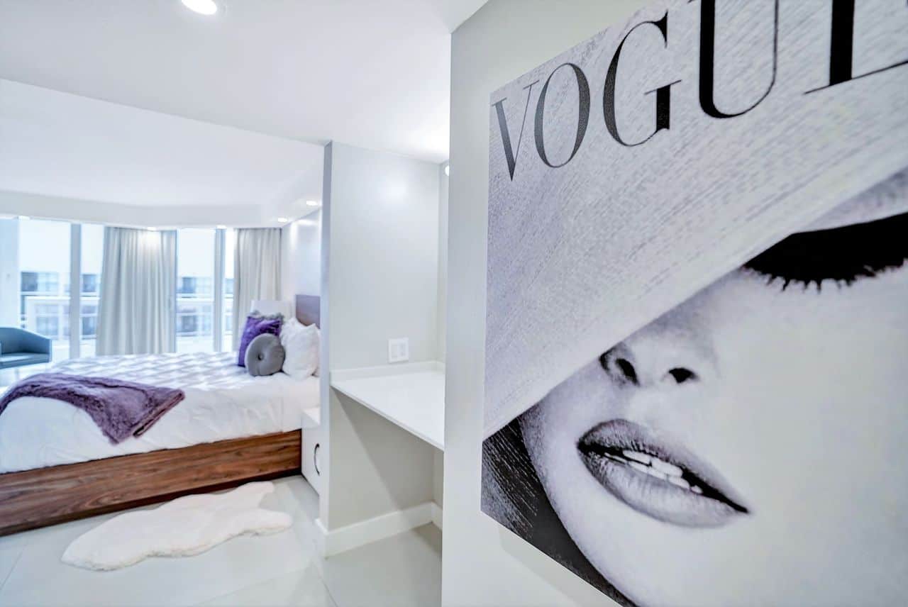 Master bedroom, king bed, vanity, desk, balcony access, walk in closet, master bathroom, tv